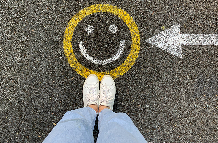 Smiley emoji on the road