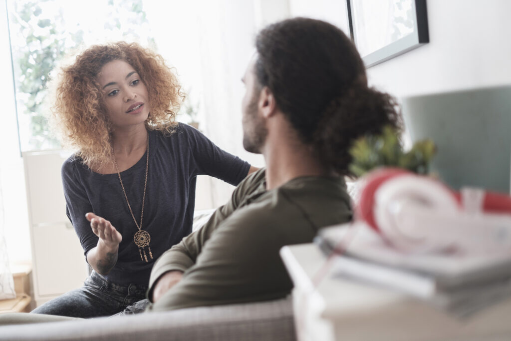 Couple having a conversation at home