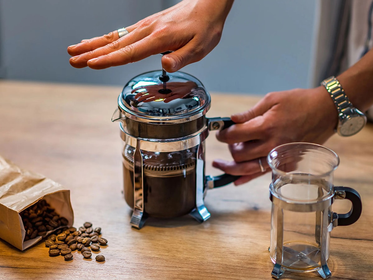 A Man is pressing French Coffee Machine 