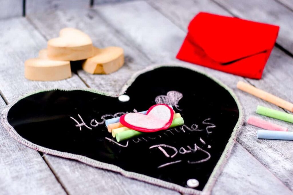 Heart-Shaped Chalkboard with Chalks