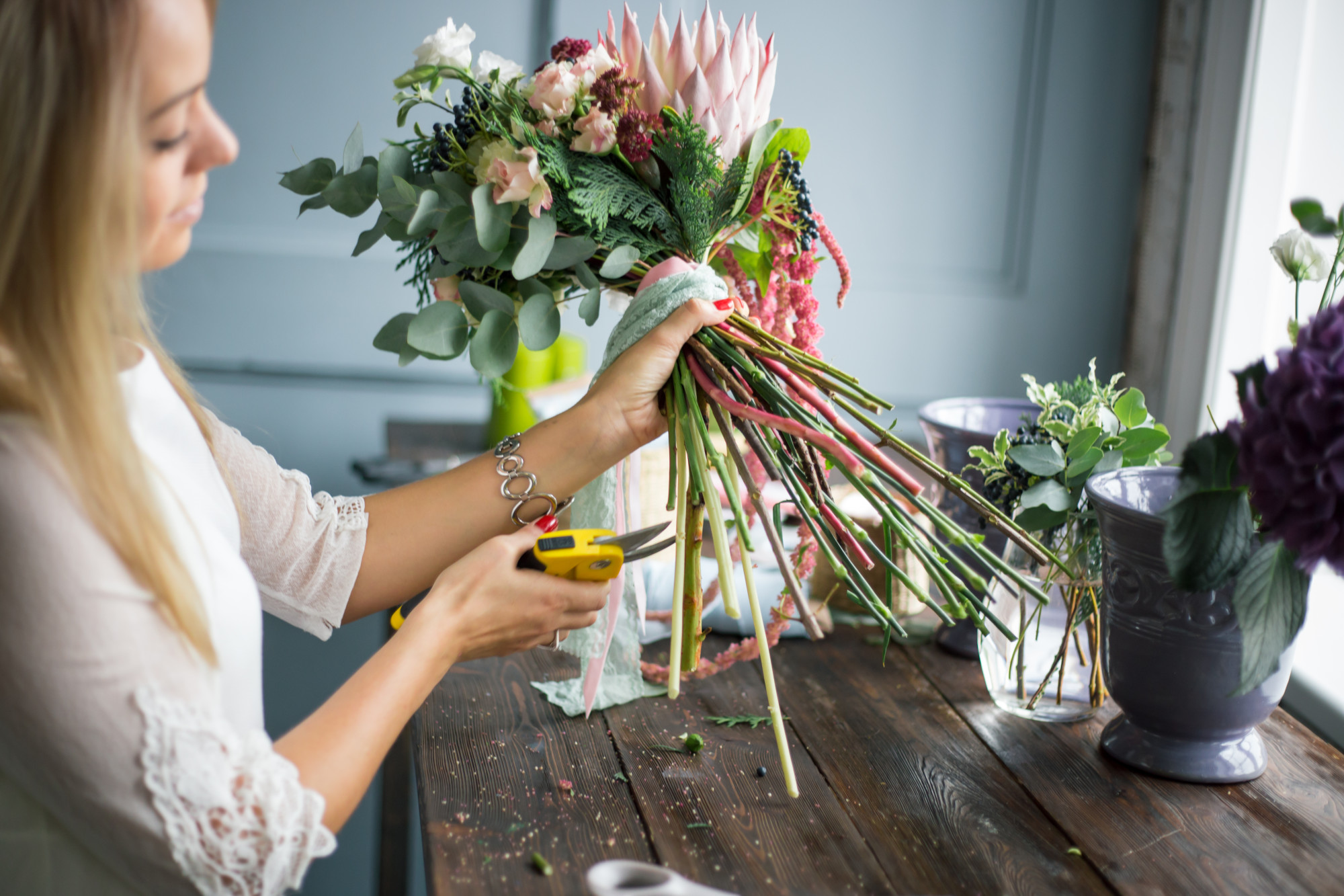 Lady Cutting Flowers Stems