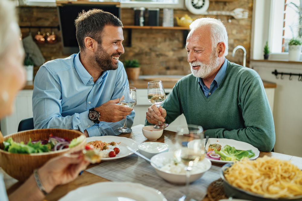 Fathers And Sons Having Dinner