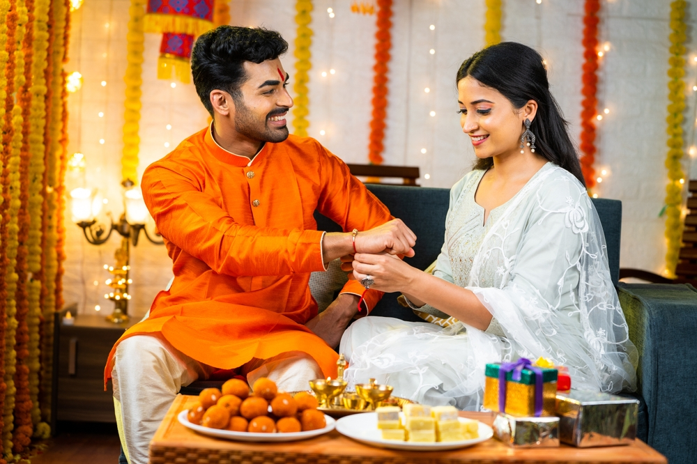 Sister tying rakhi to his brother