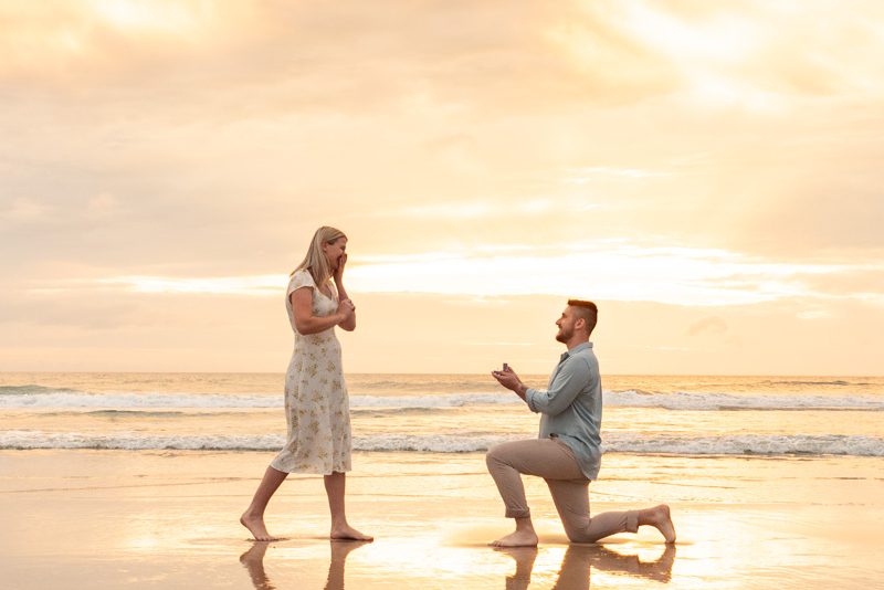 Romantic sunrise beach proposal